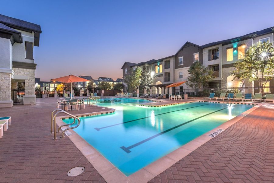 outdoor pool area at forum at denton station apartments