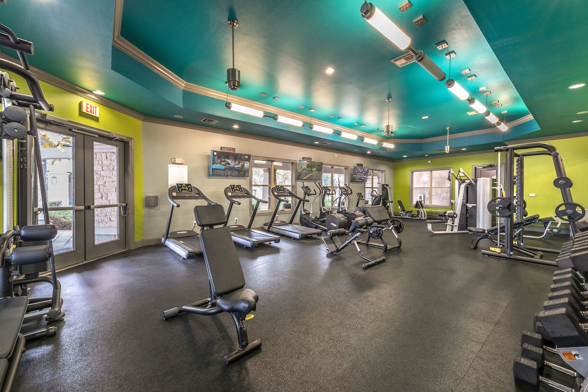 exercise room inside forum at denton station apartments